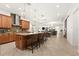 Spacious kitchen with granite countertops, a large island with seating, and stainless steel appliances at 10824 Royal Cypress Way, Orlando, FL 32836