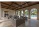 Relaxing community lounge area overlooking the pool with comfortable seating and stylish decor at 10824 Royal Cypress Way, Orlando, FL 32836