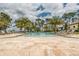 Relaxing pool area with lounge chairs at 10824 Royal Cypress Way, Orlando, FL 32836