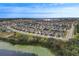 Community aerial view showcasing the neighborhood layout and surrounding greenery at 1416 Cabot Dr, Clermont, FL 34711