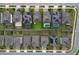 Aerial view of neighborhood homes with solar panels, backyard pools, and green lawns at 1416 Cabot Dr, Clermont, FL 34711