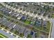 Birds-eye view of neighborhood homes featuring backyard pools, solar panels, and well-kept landscaping at 1416 Cabot Dr, Clermont, FL 34711