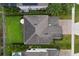 Aerial view of home highlighting a spacious backyard with green lawn and patio area at 1416 Cabot Dr, Clermont, FL 34711