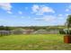 Lush backyard with manicured lawn, offering serene views of the surrounding landscape at 1416 Cabot Dr, Clermont, FL 34711