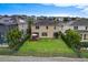 View of a well-maintained backyard with a manicured lawn, fence, and seating area at 1416 Cabot Dr, Clermont, FL 34711