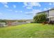 Expansive backyard with patio, landscaped yard, and scenic views, ideal for outdoor living at 1416 Cabot Dr, Clermont, FL 34711