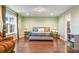 Spacious main bedroom featuring hardwood floors and ample natural light at 1416 Cabot Dr, Clermont, FL 34711