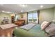 Bedroom features a fireplace, seating area, and views of the backyard at 1416 Cabot Dr, Clermont, FL 34711