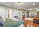 Open main bedroom featuring an en-suite bathroom, laundry, and a stone fireplace at 1416 Cabot Dr, Clermont, FL 34711