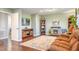 Bedroom includes a stone fireplace, entertainment center, and en-suite bathroom at 1416 Cabot Dr, Clermont, FL 34711