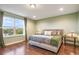 Bright bedroom offering lush backyard views and hardwood floors at 1416 Cabot Dr, Clermont, FL 34711