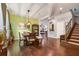 Inviting dining room featuring hardwood floors, modern lighting, and stylish decor at 1416 Cabot Dr, Clermont, FL 34711