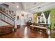 Spacious dining area with hardwood floors, staircase, and views of the entryway at 1416 Cabot Dr, Clermont, FL 34711
