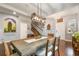 Bright dining room with hardwood floors, stylish lighting, and comfortable seating at 1416 Cabot Dr, Clermont, FL 34711