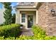Inviting front entrance with a wreath, stone accents, and lush landscaping at 1416 Cabot Dr, Clermont, FL 34711