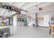 Large garage featuring epoxy flooring and organized storage solutions for bikes and equipment at 1416 Cabot Dr, Clermont, FL 34711