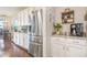 Modern kitchen featuring stainless steel appliances, granite countertops, and decorative accents for added charm at 1416 Cabot Dr, Clermont, FL 34711