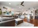 Spacious open-concept layout with a living room flowing into a modern kitchen with sleek cabinetry and an island at 1416 Cabot Dr, Clermont, FL 34711