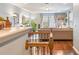Open-concept living room with hardwood floors, natural light, and cozy furniture at 1416 Cabot Dr, Clermont, FL 34711