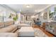 Inviting living room with a large sectional sofa, workspace, and stylish decor at 1416 Cabot Dr, Clermont, FL 34711