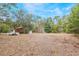 Spacious backyard with mature trees and shed at 15941 Sw 8Th Pl, Ocala, FL 34481