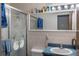 Small bathroom with shower, sink, and vanity at 15941 Sw 8Th Pl, Ocala, FL 34481