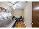 Small bedroom with a sleeper sofa and wooden desk at 15941 Sw 8Th Pl, Ocala, FL 34481