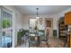 Small dining area with glass table and four chairs at 15941 Sw 8Th Pl, Ocala, FL 34481