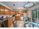 Eat-in kitchen with wood cabinets and appliances at 15941 Sw 8Th Pl, Ocala, FL 34481