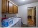 Laundry room with washer, dryer, and additional storage at 15941 Sw 8Th Pl, Ocala, FL 34481