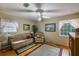 Living room with hardwood floors, couch, and recliner at 15941 Sw 8Th Pl, Ocala, FL 34481