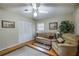Living room with hardwood floors and seating at 15941 Sw 8Th Pl, Ocala, FL 34481