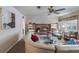 Living room featuring a fireplace and large windows at 15941 Sw 8Th Pl, Ocala, FL 34481
