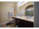 Clean bathroom with dark wood vanity and shower at 16307 Old Ash Loop, Orlando, FL 32828