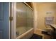 Bathroom with a shower/tub combo and tile flooring at 16307 Old Ash Loop, Orlando, FL 32828