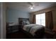 Bedroom with wood floors, double bed, and window at 16307 Old Ash Loop, Orlando, FL 32828