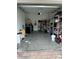Garage with shelving, tools and some storage items at 16307 Old Ash Loop, Orlando, FL 32828