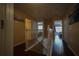 Upstairs hallway with wood flooring and access to bedrooms at 16307 Old Ash Loop, Orlando, FL 32828