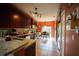 Kitchen with granite countertops and dark wood cabinets at 16307 Old Ash Loop, Orlando, FL 32828