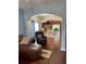 Living room with hardwood floors, view of kitchen, and comfy seating at 16307 Old Ash Loop, Orlando, FL 32828