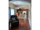 Living room with hardwood floors and view of kitchen at 16307 Old Ash Loop, Orlando, FL 32828