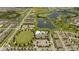 Aerial view of community, including pool, lake, and homes at 16626 Point Rock Dr, Winter Garden, FL 34787