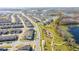 Aerial view of a community with houses, a lake, and playground at 16626 Point Rock Dr, Winter Garden, FL 34787