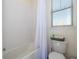 Bathroom with white tile, bathtub and shower at 16626 Point Rock Dr, Winter Garden, FL 34787