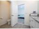 Small bathroom with toilet and access to bedroom at 16626 Point Rock Dr, Winter Garden, FL 34787