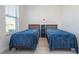 Bedroom with two twin beds, window and light walls at 16626 Point Rock Dr, Winter Garden, FL 34787
