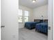 Bedroom with two twin beds and light flooring at 16626 Point Rock Dr, Winter Garden, FL 34787