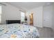 Bright bedroom with a queen bed, dresser and ensuite bathroom at 16626 Point Rock Dr, Winter Garden, FL 34787