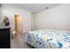 Bedroom with ensuite bathroom access and a floral comforter at 16626 Point Rock Dr, Winter Garden, FL 34787