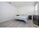 Bedroom with dresser, nightstands, and floral bedding at 16626 Point Rock Dr, Winter Garden, FL 34787